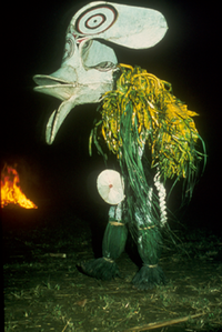 Baining fire dancer, New Britain, Papua New Guinea. The disk is attached to his genitals with a large safety pin. Ouch!