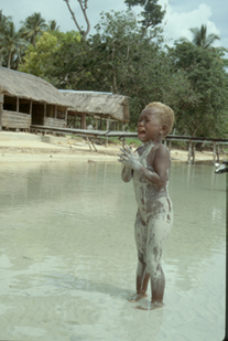 Covered in sand, south coast of New Britain Island, So Pacific